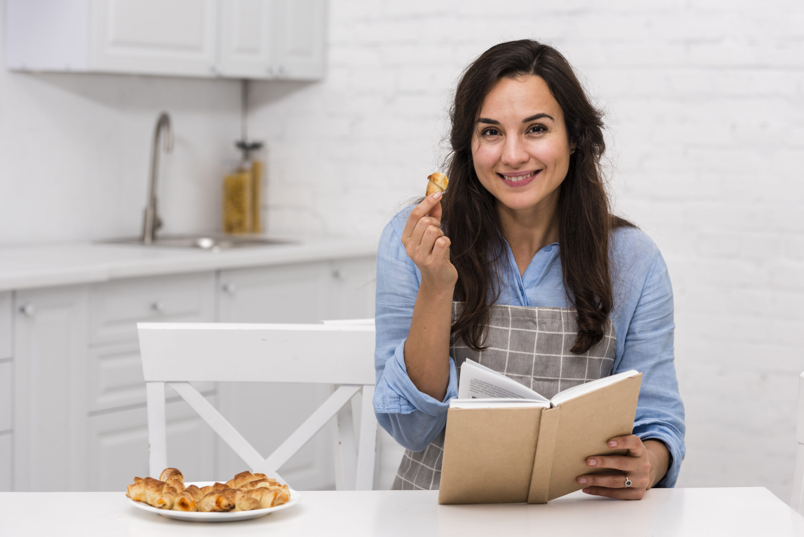 young-woman-reading-book-kitchen